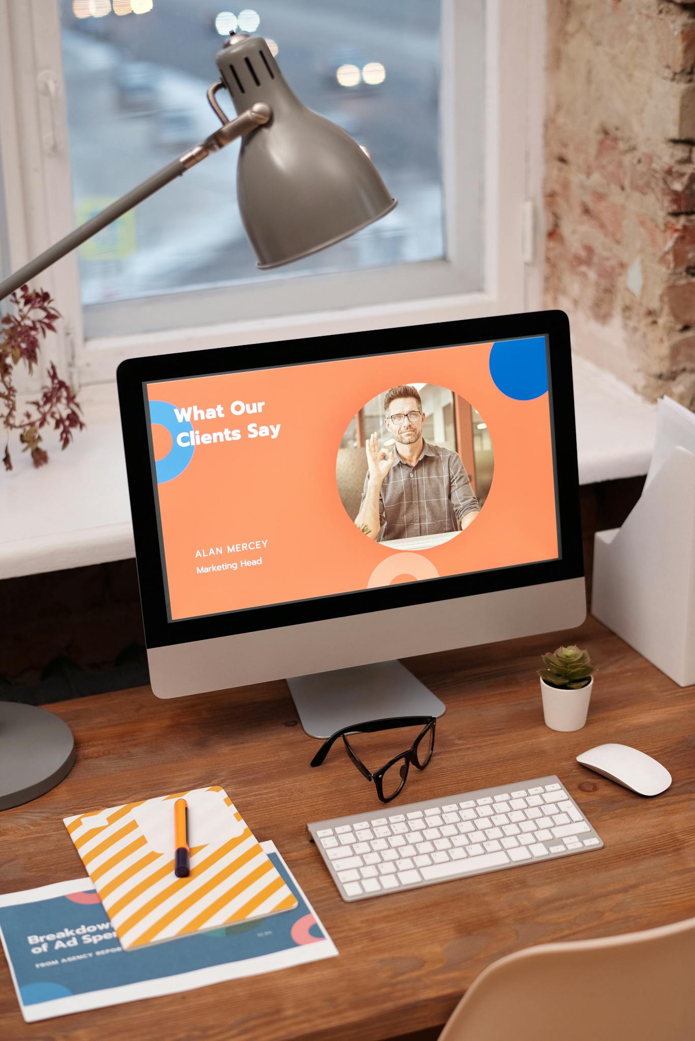 About 11 Stylish home office setup with computer showcasing client testimonials.